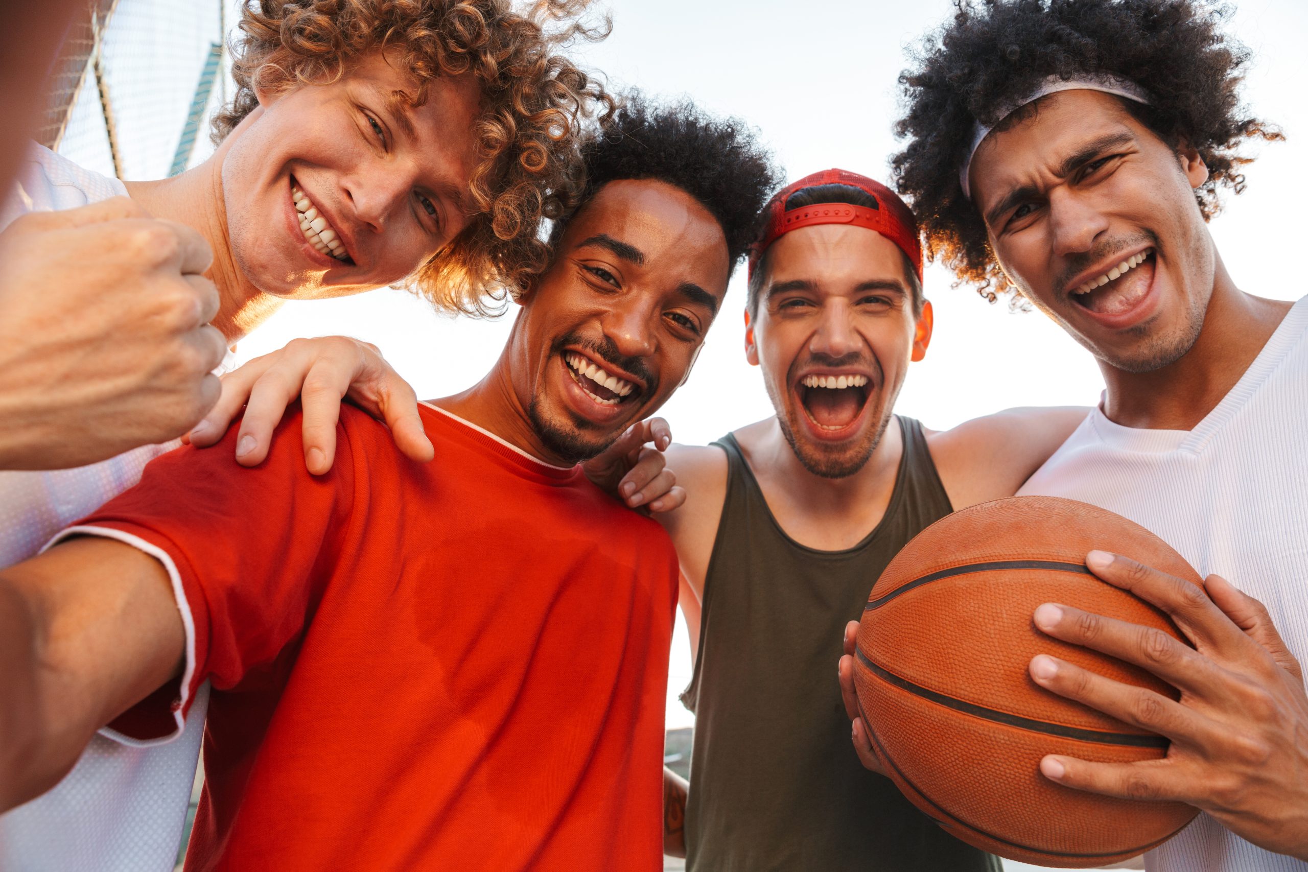 Photo closeup of handsome players men smiling and taking selfie, while playing basketball at playground outdoor during summer sunny day scottgrallaacupuncture, greenlawnny